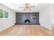 Spacious living room with modern decor, a dark fireplace, and a ceiling fan at 1904 27Th Avenue Ne Dr, Hickory, NC 28601