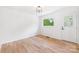 Bright, minimalist room with hardwood floors and a large window at 1904 27Th Avenue Ne Dr, Hickory, NC 28601