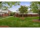 Well-maintained backyard with manicured lawn and charming brick privacy fence, perfect for outdoor relaxation at 20217 Middletown Rd, Cornelius, NC 28031