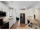 Modern kitchen with stainless steel appliances, granite countertops, and white cabinets, blending style and functionality at 20217 Middletown Rd, Cornelius, NC 28031