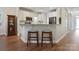 Eat-in kitchen with stainless steel appliances, granite countertops, and seating for two at 20217 Middletown Rd, Cornelius, NC 28031