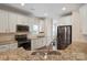 Well-lit kitchen features granite countertops, stainless steel appliances and white cabinets at 20217 Middletown Rd, Cornelius, NC 28031