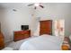Spacious main bedroom featuring wood furnishings, and ensuite bathroom with a walk-in shower at 20217 Middletown Rd, Cornelius, NC 28031