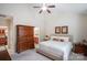 Bright main bedroom with ceiling fan, ensuite bathroom, wooden furnishings and walk-in closet at 20217 Middletown Rd, Cornelius, NC 28031