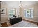 Well-lit home office with neutral walls, hardwood floors, and framed art, creating a productive workspace at 20217 Middletown Rd, Cornelius, NC 28031