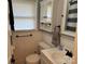 Cozy bathroom features vanity with storage, toilet, mirror, and window with blinds at 2122 Hope Dr, Rock Hill, SC 29730