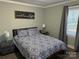 Comfortable bedroom with a blue and white patterned bedspread, complemented by soft lighting at 2122 Hope Dr, Rock Hill, SC 29730
