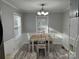 The dining room features a wood table with chairs, natural light, and charming decor at 2122 Hope Dr, Rock Hill, SC 29730