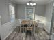 Cozy dining room with a wooden table, four chairs, and natural light, perfect for Gathering meals at 2122 Hope Dr, Rock Hill, SC 29730