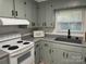 Well-maintained kitchen features ample counter space, cabinets, and modern white appliances at 2122 Hope Dr, Rock Hill, SC 29730