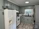 Functional kitchen featuring ample cabinet space, modern appliances, and wood-look flooring at 2122 Hope Dr, Rock Hill, SC 29730