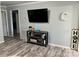 Bright living room features a mounted television, wood-look flooring, and modern decorative touches at 2122 Hope Dr, Rock Hill, SC 29730