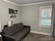 Inviting living room with a gray sofa, offering a comfortable space for relaxation and entertainment at 2122 Hope Dr, Rock Hill, SC 29730