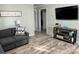 Cozy living room showcases wood-look floors, modern decor, and a comfortable gray sofa at 2122 Hope Dr, Rock Hill, SC 29730