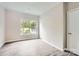 Bright bedroom with natural light through the window, base molding and a closet at 2515 Carya Pond Ln, Charlotte, NC 28212