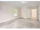 Bright bedroom with new flooring, window, walk-in closet and base molding at 2515 Carya Pond Ln, Charlotte, NC 28212