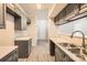 Bright kitchen featuring stainless steel sink, ample counter space, and modern cabinetry at 2515 Carya Pond Ln, Charlotte, NC 28212