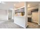 Bright living room showcasing open access to the kitchen area and a large breakfast bar at 2515 Carya Pond Ln, Charlotte, NC 28212