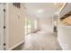 Spacious living room with sliding glass doors to a covered patio and neutral wall color at 2515 Carya Pond Ln, Charlotte, NC 28212