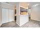 Open living room showing the kitchen pass through and an ample closet with white paneled doors at 2515 Carya Pond Ln, Charlotte, NC 28212