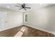 Cozy bedroom with hardwood floors, natural light, and modern ceiling fan at 2668 Polo Ln, Maiden, NC 28650