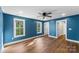 Large bedroom with hardwood floors, two bright windows and crisp white trim at 2668 Polo Ln, Maiden, NC 28650