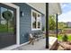 Close up of an inviting front porch with seating area and stylish decor at 2668 Polo Ln, Maiden, NC 28650