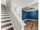 Staircase leading to a bonus room with a ceiling fan and blue walls, creating an inviting atmosphere at 2668 Polo Ln, Maiden, NC 28650