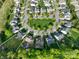 Aerial view of a residential neighborhood, showcasing well-maintained homes and tree-lined streets at 2684 Sunberry Nw Ln, Concord, NC 28027