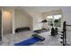 Virtually staged basement with fitness equipment, neutral walls, and carpet flooring at 2684 Sunberry Nw Ln, Concord, NC 28027