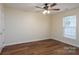 Bedroom featuring hardwood floors, neutral wall color and natural light from a window at 2684 Sunberry Nw Ln, Concord, NC 28027