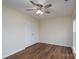 Bedroom featuring hardwood floors, neutral wall color and a ceiling fan at 2684 Sunberry Nw Ln, Concord, NC 28027