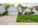 Charming single-Gathering home with a well-manicured lawn and attached two-car garage at 2684 Sunberry Nw Ln, Concord, NC 28027