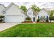 Charming single-Gathering home featuring a well-manicured lawn, a two-car garage, and a traditional white exterior at 2684 Sunberry Nw Ln, Concord, NC 28027
