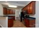 Kitchen featuring modern appliances, plenty of counter space, and warm wood cabinets for ample storage at 2684 Sunberry Nw Ln, Concord, NC 28027