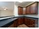Kitchen with dark countertops, dark cabinets, and stainless steel appliances at 2684 Sunberry Nw Ln, Concord, NC 28027