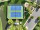Aerial view featuring two tennis courts next to a playground, community parking and pond at 2684 Sunberry Nw Ln, Concord, NC 28027