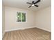 Bedroom featuring hardwood floors, window with natural light, and neutral wall colors at 2717 Springway Dr, Charlotte, NC 28205