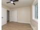 Bedroom featuring ceiling fan, hardwood floors, window, closet and bathroom doorway at 2717 Springway Dr, Charlotte, NC 28205