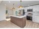 Newly renovated kitchen featuring an island and modern stainless steel appliances at 2717 Springway Dr, Charlotte, NC 28205