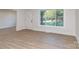 Bright living room featuring a large picture window with natural light and hardwood floors at 2717 Springway Dr, Charlotte, NC 28205