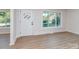 Bright living room featuring updated flooring, freshly painted walls, and large windows allowing for natural light at 2717 Springway Dr, Charlotte, NC 28205