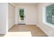 Bright room features wood look floors, closet and a back door at 2717 Springway Dr, Charlotte, NC 28205