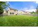 Large backyard featuring a lush green lawn, with patio furniture, perfect for outdoor entertaining at 3039 Keswick Ter, Indian Land, SC 29707