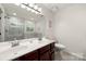 Bright bathroom with double vanity, a large mirror, and tile flooring at 3039 Keswick Ter, Indian Land, SC 29707