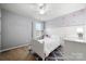 Bright bedroom featuring heart decals, a large window, and warm decor, creating a cute atmosphere at 3039 Keswick Ter, Indian Land, SC 29707