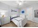 Well-lit bedroom featuring a white panel wall, stylish furniture, and carpeted floors, creating a comfortable space at 3039 Keswick Ter, Indian Land, SC 29707