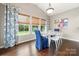 Breakfast nook featuring large windows, decorative lighting, and hardwood floors at 3039 Keswick Ter, Indian Land, SC 29707