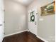 View of entryway featuring hardwood floors, a glass paneled door, and a decorative painting on the wall at 3039 Keswick Ter, Indian Land, SC 29707