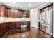 Well-lit kitchen featuring stainless steel appliances, granite countertops, and dark wood cabinets at 3039 Keswick Ter, Indian Land, SC 29707